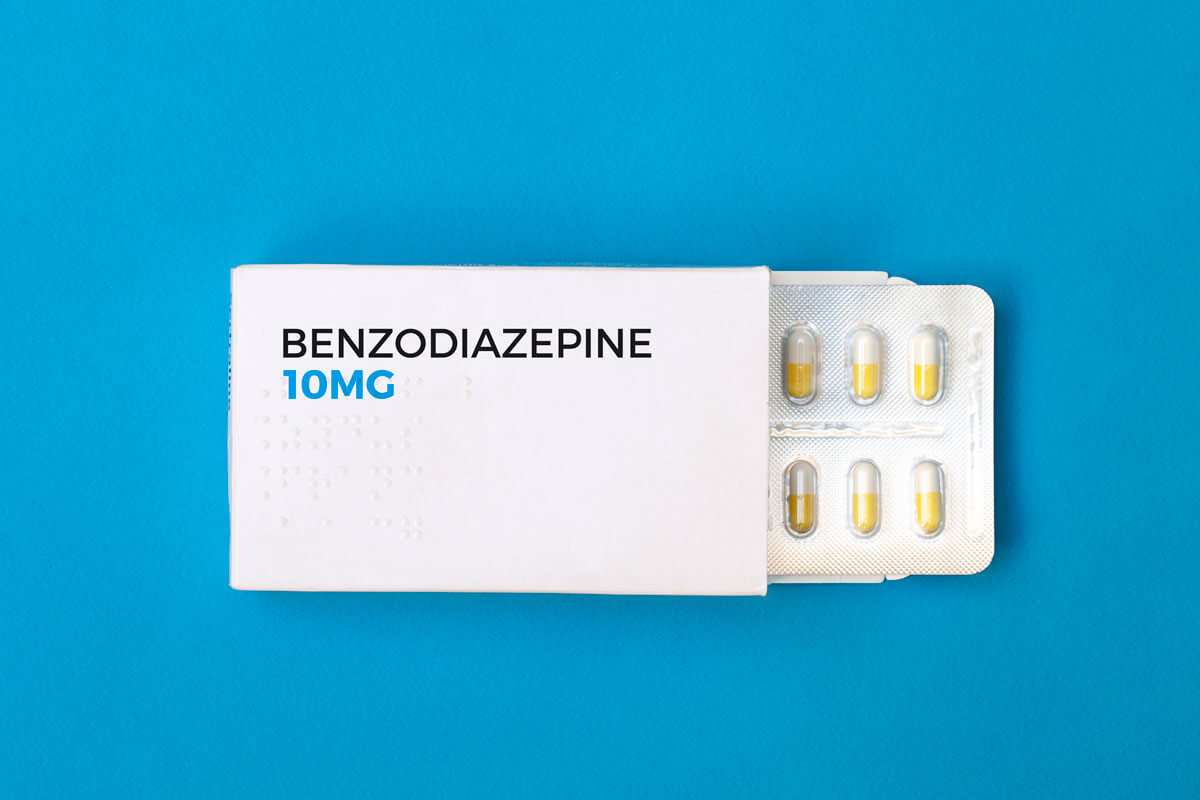 A close-up image of benzodiazepine 10mg tablets displayed on a white background, highlighting their round shape and imprint.